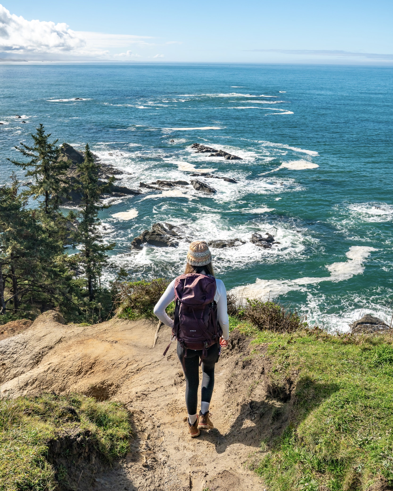Ruby hikes on a clear sunny day in Cape Arago State Park overlooking the Pacific Ocean. Photo by Ruby Tawes