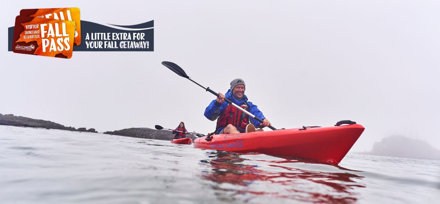 Two people kayaking on calm, foggy coastal waters, with Fall Pass promotional badge