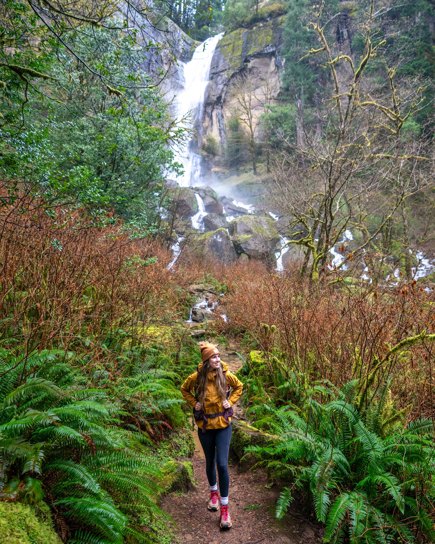 Ruby stands in front of a waterfall during a recent visit to Golden and Silver Falls State Natural Area in Coos County, Oregon