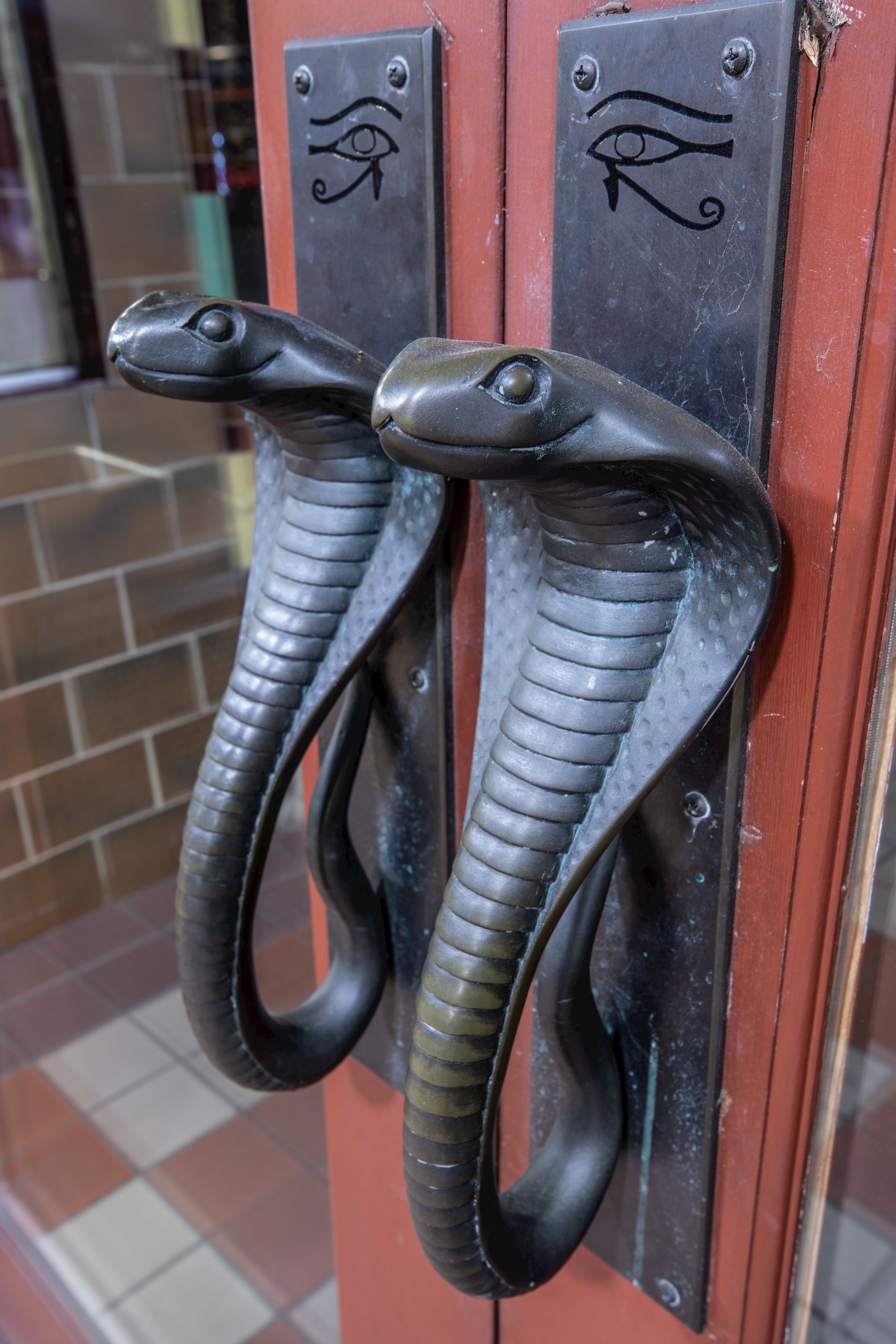 Cobra-shaped door handles at the entrance of the Egyptian Theatre in Coos Bay, Oregon, a design detail dating back to the theatre’s 1925 debut.