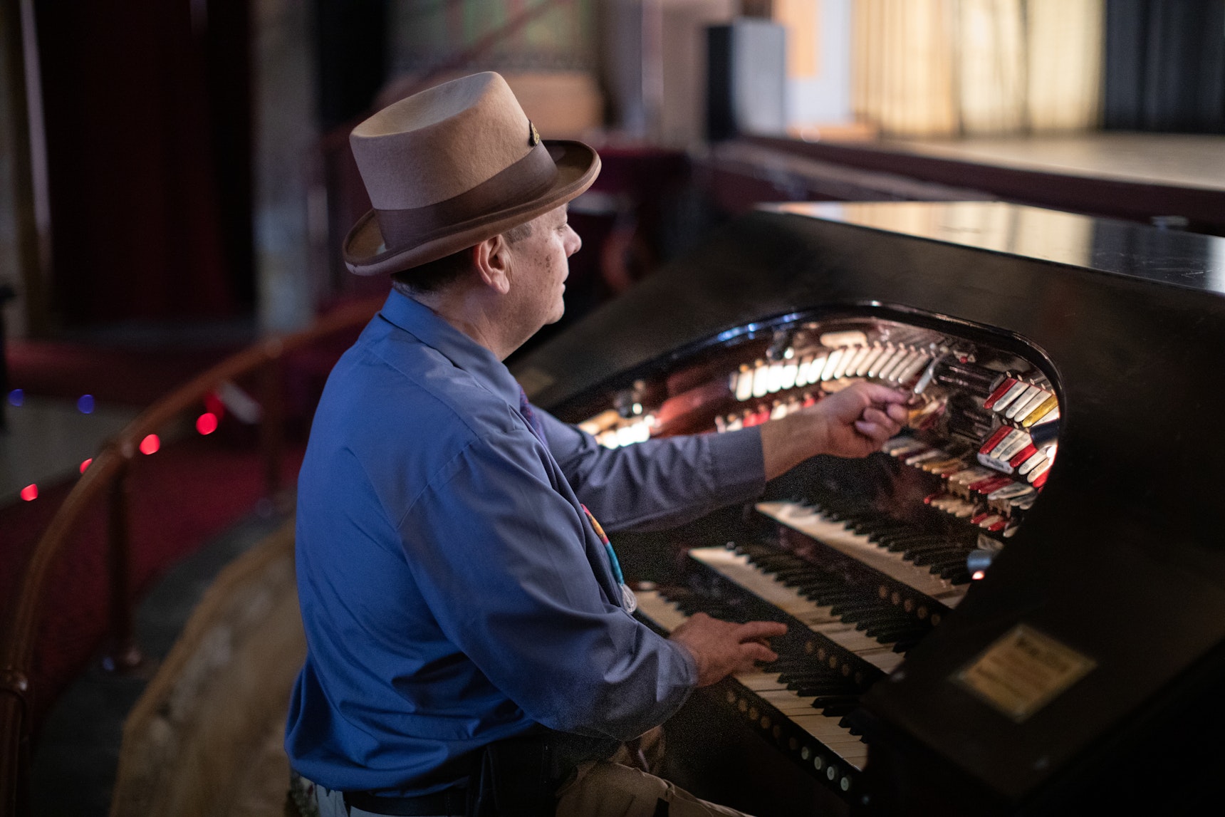 A man plays the giant Wurlitzer Pipe Organ, still in its original location inside the Egyptian Theatre in downtown Coos Bay 100 years later.