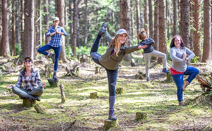 Woodland yoga pose in Shore Acres State Park